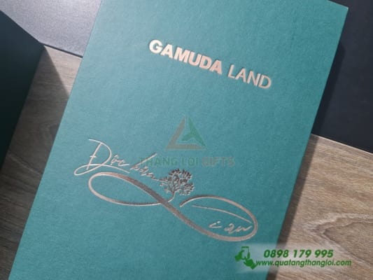 Hop Am Duong ep kim vang logo GAMUDA LAND dung Ruou