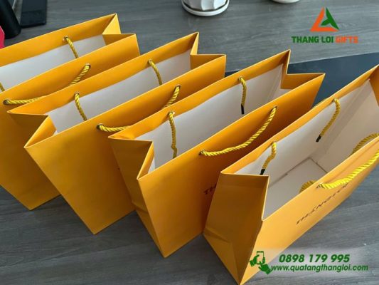 Tui Xach Giay Mau Vang - Ép Kim Logo Doanh Nghiep THANG LOI Loyalty