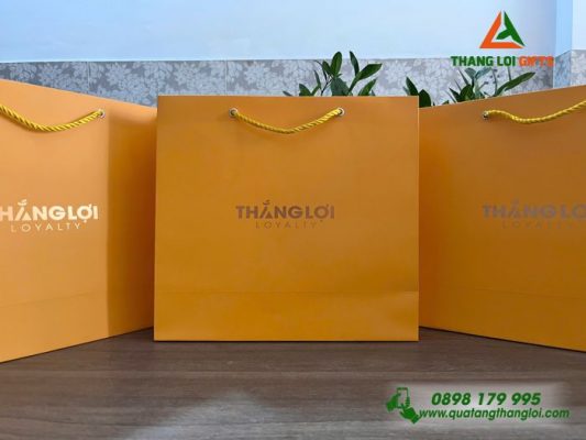 Tui Xach Giay Mau Vang - Ép Kim Logo Doanh Nghiep THANG LOI Loyalty