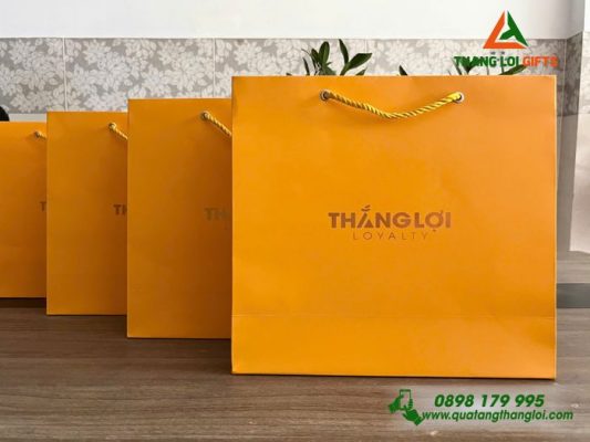 Tui Xach Giay Mau Vang - Ép Kim Logo Doanh Nghiep THANG LOI Loyalty