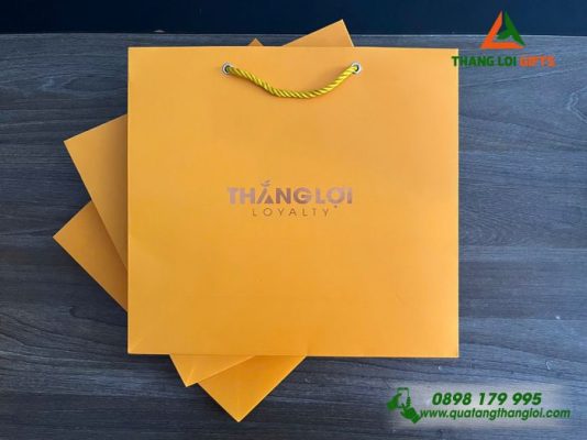 Tui Xach Giay Mau Vang - Ép Kim Logo Doanh Nghiep THANG LOI Loyalty